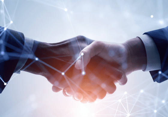 Hand shake with digital interconnectivity displayed throughout